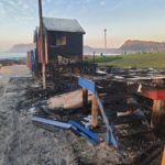 St James Beach iconic colourful bathing huts burn