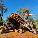 South African trophy hunter proudly poses with giraffe heart