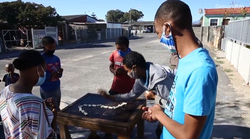 An after school dominoes club in Belhar, Cape Town